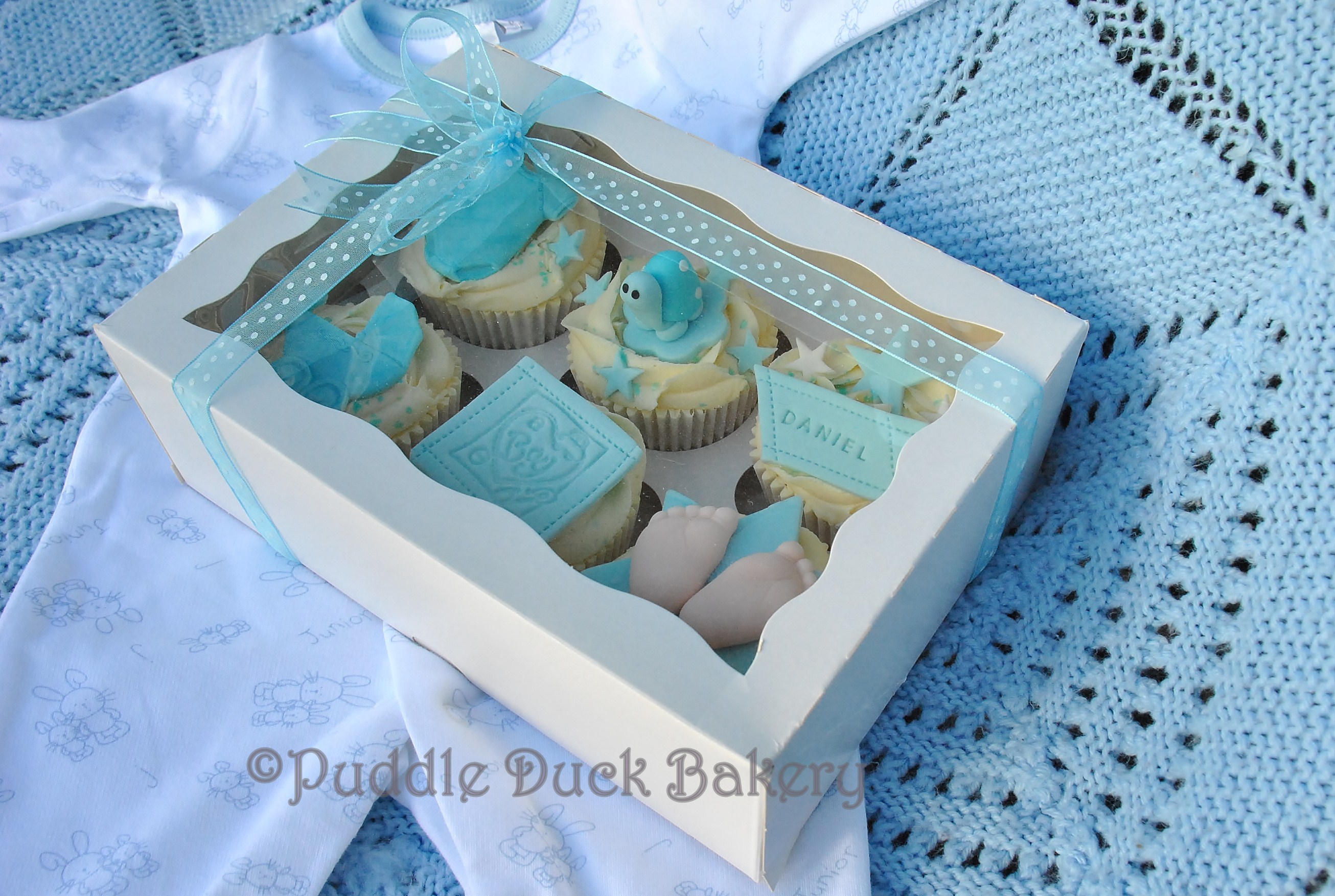 A display box with some cupcakes