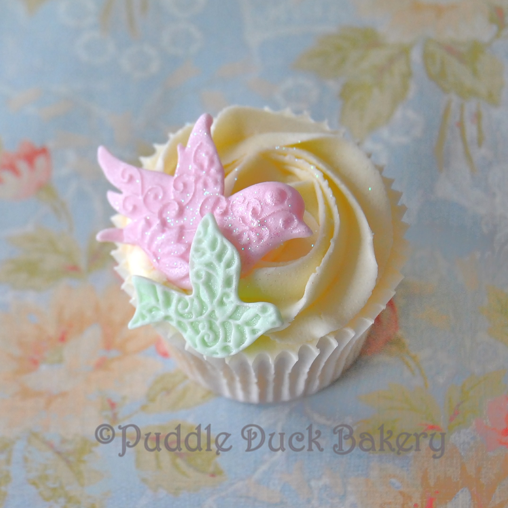 Gorgeous textured birds on a cupcake