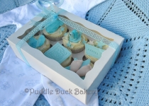 A display box with some cupcakes